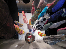 Textiles hanging in tub shapes by Reiko